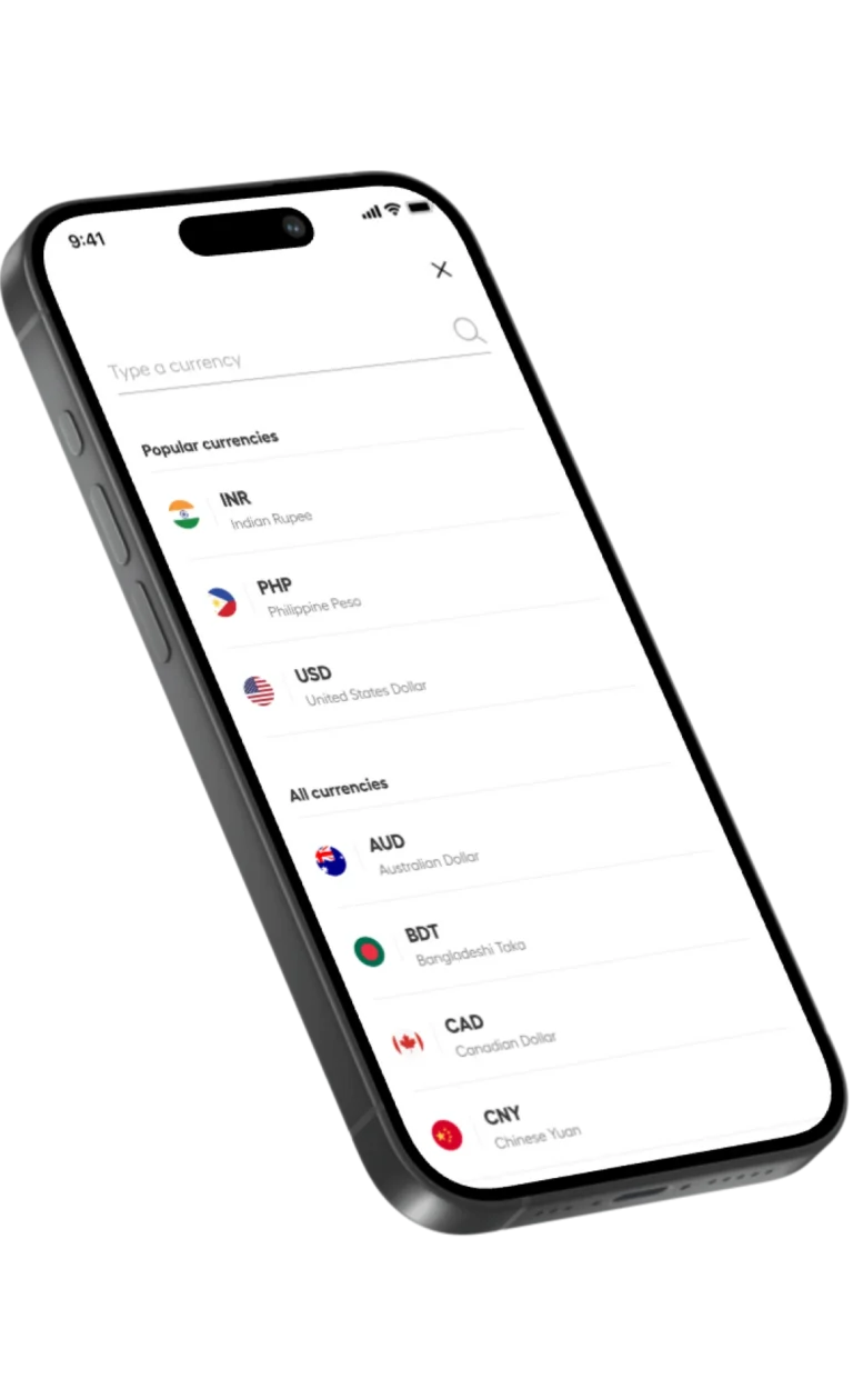 Tilted smartphone showing a currency picker list with flags: INR, PHP, USD, AUD and more, plus a search line at the top