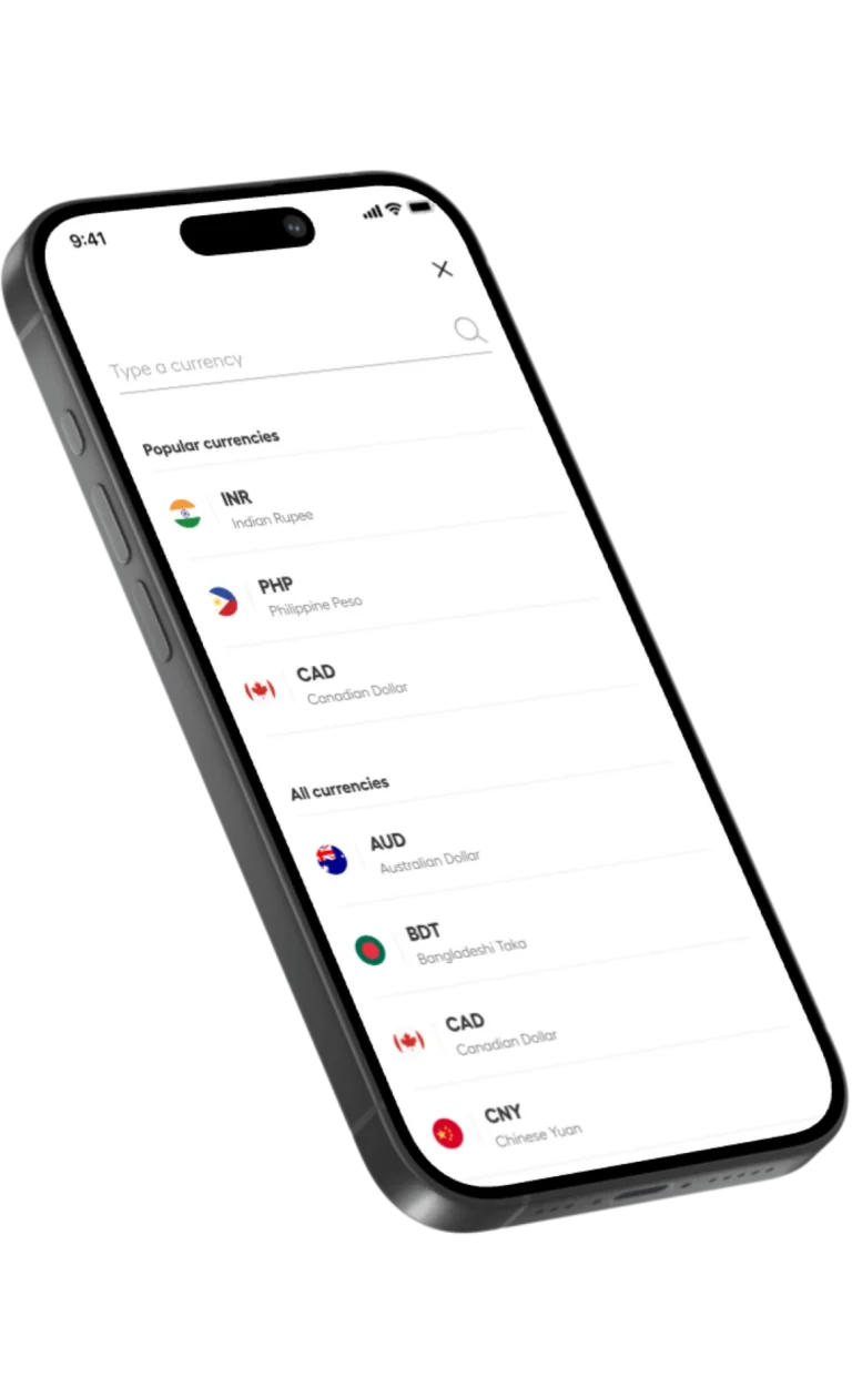 Tilted smartphone screen showing a currency converter app with a list of popular currencies (INR, PHP, CAD, AUD, BDT, CNY) and country names like Indian Rupee, Philippine Peso, Canadian Dollar, Australian Dollar, etc.