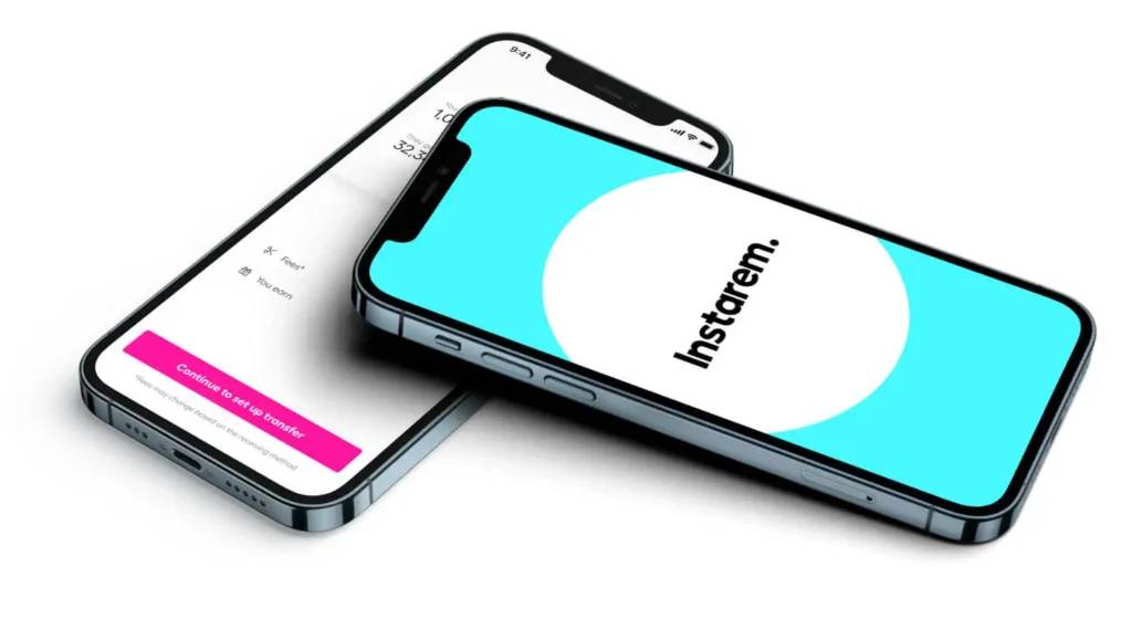 Two angled smartphones displaying a fintech app onboarding screen, one with a pink 'Continue to set up transfer' button and the other showing a blue screen with a white circle.